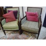 A set of three modern armchairs with stained show frames and coordinating upholstery