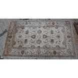 A Ziegler designed rug, the central panel set with all over foliate design on a cream ground approx.
