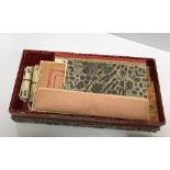 A vintage carved bamboo and bone mah-jong set in silkwork decorated rectangular box,