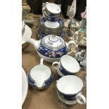 A Wedgwood "Blue Siam" six place tea service comprising teacups and saucers, side plates, teapot,