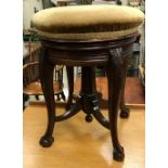 A Victorian mahogany circular adjustable piano stool by James Shoolbred,
