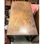 A Victorian mahogany drop-leaf dining table,