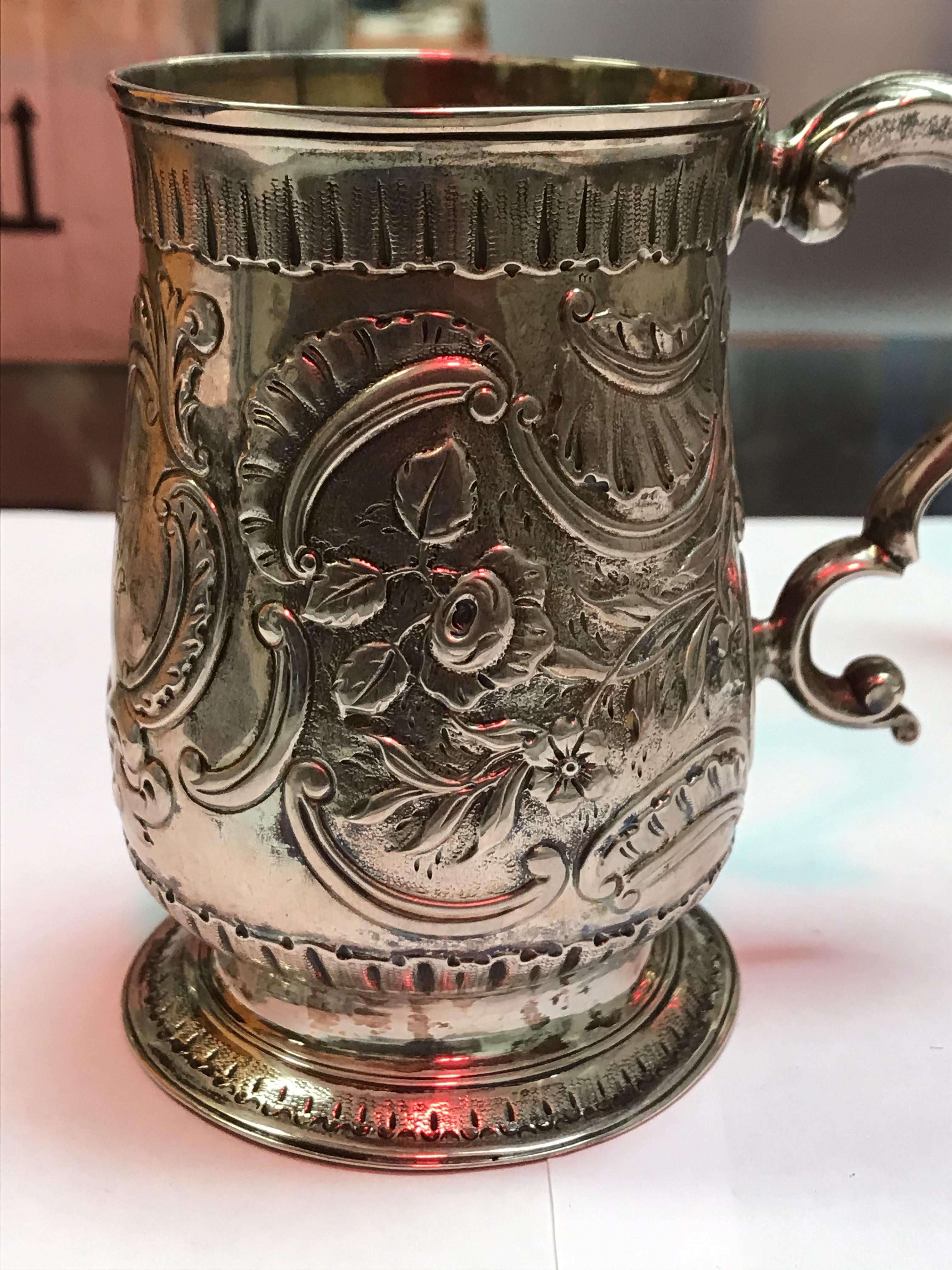 A George II silver baluster shaped mug with later foliate engraved decoration, - Image 8 of 42
