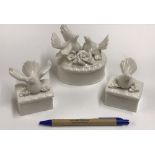 A collection of four oval porcelain trinket boxes,