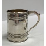 A Victorian silver Christening mug of tapering form with reeded banding and gilt-washed interior
