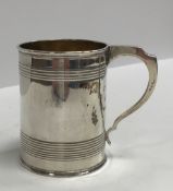 A Victorian silver Christening mug of tapering form with reeded banding and gilt-washed interior