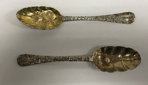 A George I silver tablespoon with later "berry" embossed and engraved decoration and gilt-washed