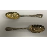 A George I silver tablespoon with later "berry" embossed and engraved decoration and gilt-washed