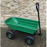 A green plastic garden truck / cargo trolley,