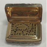 A George III silver vinaigrette of rectangular form with engraved decoration,