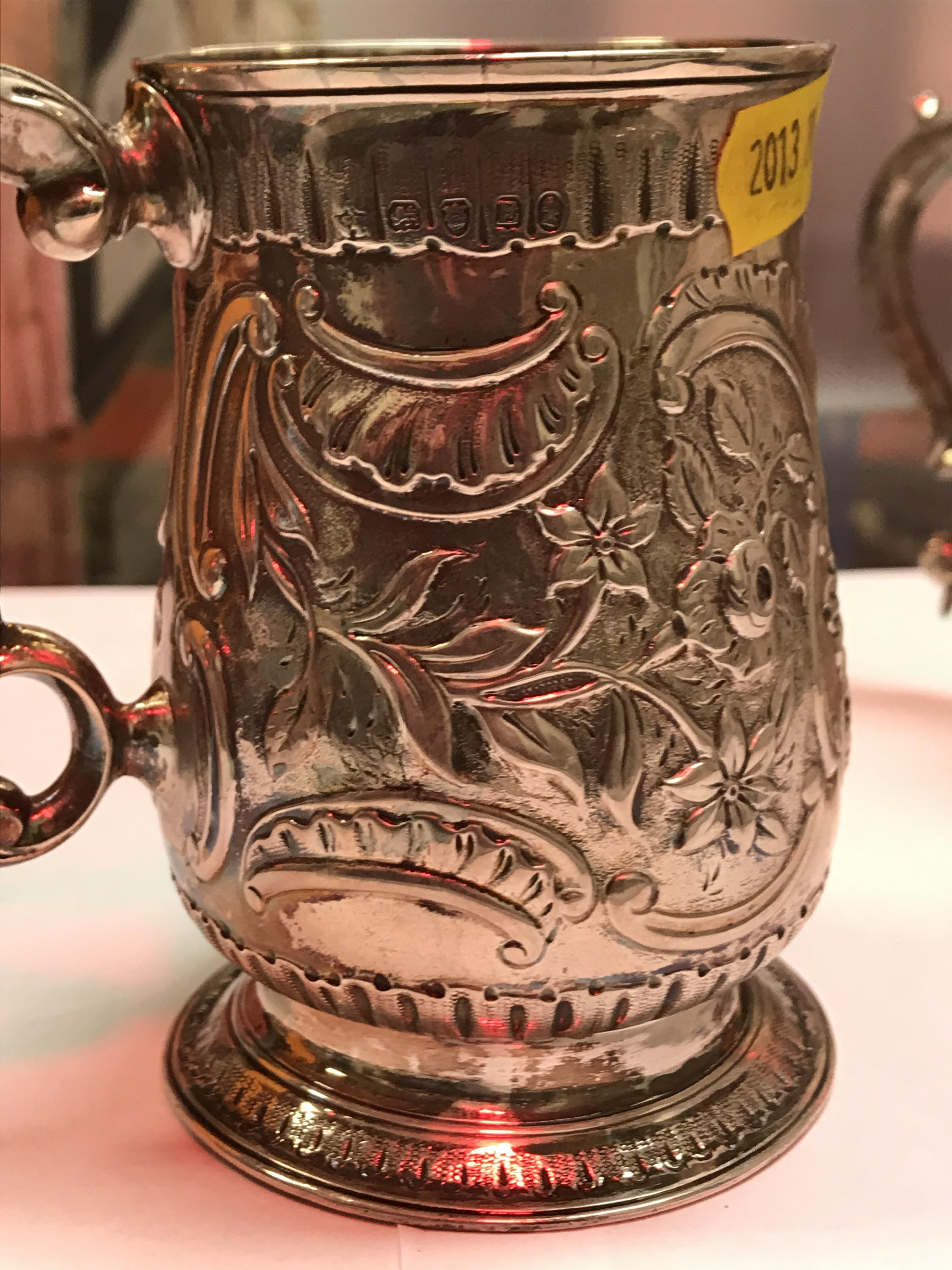 A George II silver baluster shaped mug with later foliate engraved decoration, - Image 5 of 42