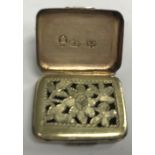 A George III silver vinaigrette of rectangular form with lozenge medallion engraved decoration,