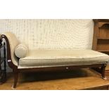 A modern chaise longue / day bed with stained show frame and cream upholstery,