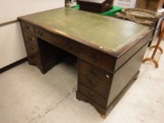 A modern reproduction mahogany double pedestal desk,