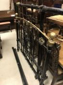 A Victorian brass and iron bedstead,
