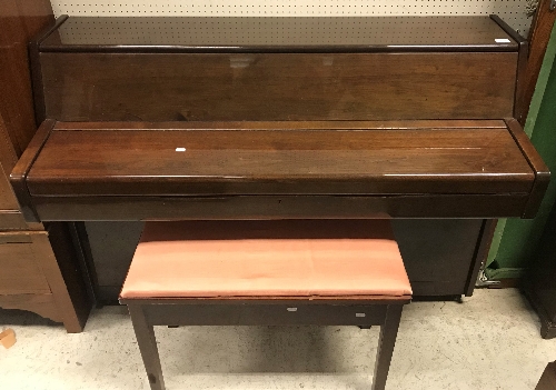 A modern mahogany cased upright piano, the framed iron overstrung movement by Schumann, 137.
