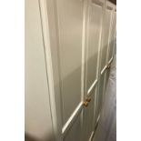 A pair of modern cream coloured and pine two door wardrobes, 90 cm wide x 53.