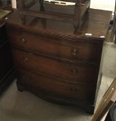 An early to mid 20th Century mahogany bow fronted chest of three long drawers in the Georgian