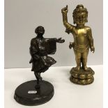 A brass Tibetan style figure of the infant Shakyamuni Buddha,