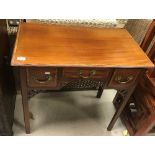 A 19th Century mahogany and satinwood cross-banded lowboy,