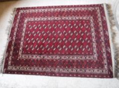 A Bokhara rug with repeating elephant fo