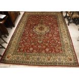 A Tabriz carpet, the central panel set w