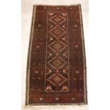 A Belouch rug, the central panel set wit