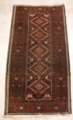 A Belouch rug, the central panel set wit