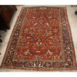 A Heriz carpet, the central panel set wi