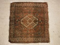 A Caucasian rug, the central panel set w