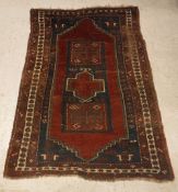 A Caucasian rug, the central panel set w