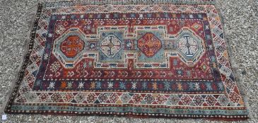 A Kazak carpet, the central panel set wi