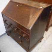 A 19th Century oak bureau, the plain top