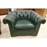 A pair of green buttoned leather upholst