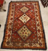 A Shiraz rug, the central panel set with