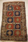 A Caucasian rug, the central panel set w