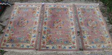 A set of three Chinese rugs, the central