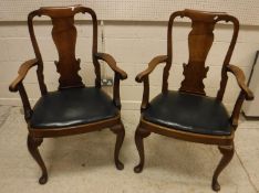 A pair of early 20th Century walnut carv