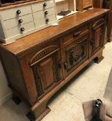 An early 20th Century oak sideboard the