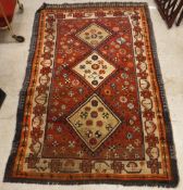 A Shiraz rug, the central panel set with