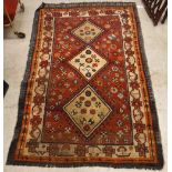 A Shiraz rug, the central panel set with