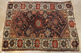 A Caucasian rug, the central panel set w