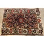 A Caucasian rug, the central panel set w