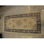 A circa 1950's Chinese rug, the central