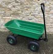 A green plastic garden truck / cargo tro