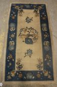 A circa 1920's Chinese rug, the central