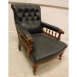 A Victorian buttoned upholstered walnut framed reclining armchair with galleried arm rails and