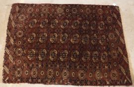 A Bokhara rug, the central panel set wit