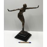 A modern cast bronze figure in the Art D