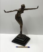 A modern cast bronze figure in the Art D